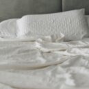 White washed cotton sheet set on a bed with pillowcase